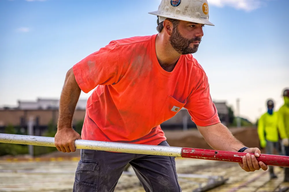 Custom branded safety orange work t-shirt for a trades crew