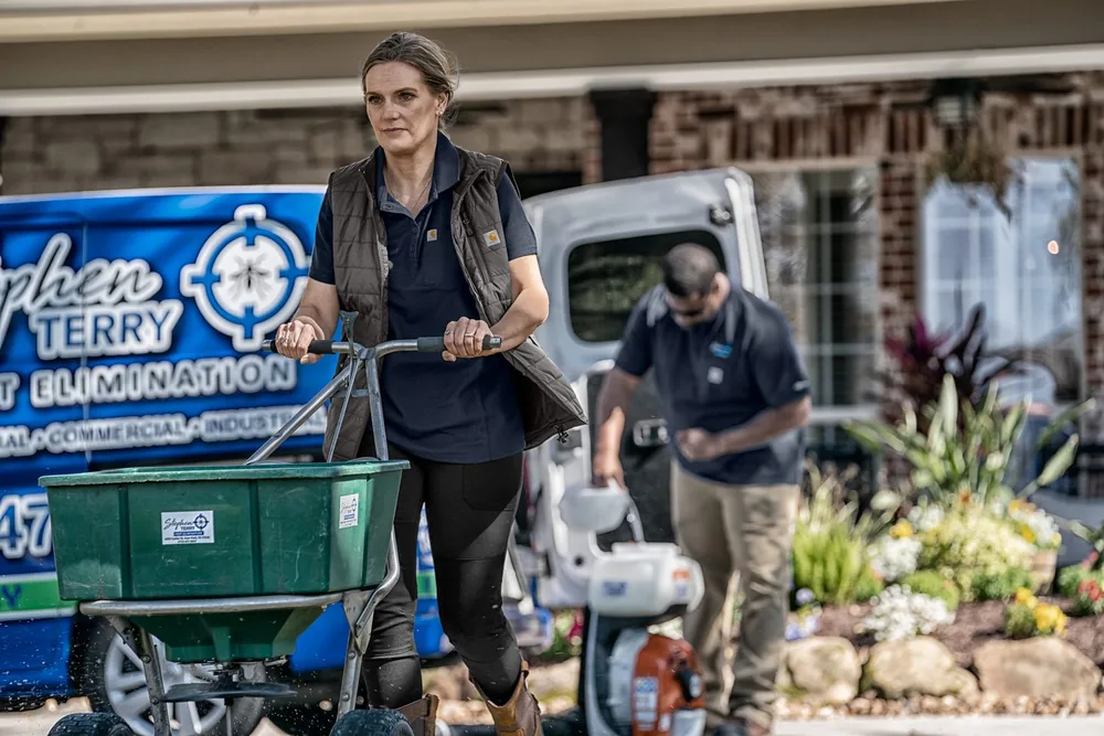 Pest control technician in custom branded company polo