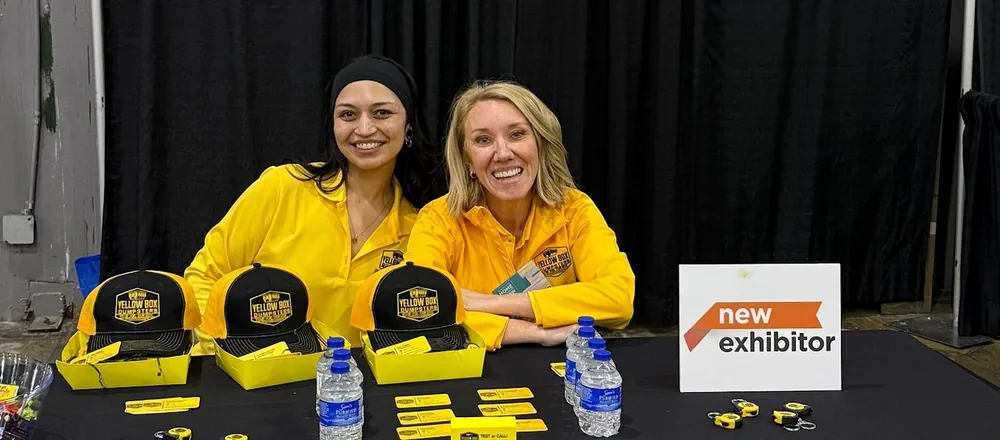Custom promotional items for Yellow Box Dumpsters at a trade show